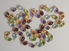 A TWENTY FOUR INCH 18CT GOLD GEM LINE NECKLACE.