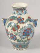 A SMALL IZNIK STYLE POTTERY VASE, 12.5cm high.