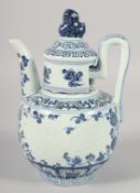 A CHINESE BLUE AND WHITE PORCELAIN LIDDED EWER, with carved phoenix, 23cm high.