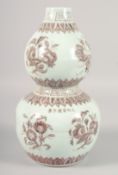 A CHINESE UNDERGLAZE RED PORCELAIN DOUBLE GOURD VASE, decorated with various fruits, bearing six-