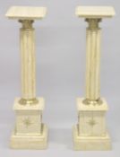 A PAIR OF BEIGE MARBLE PEDESTAL COLUMNS. 3ft 3ins high.