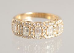 A SUPERB OCTAGONAL DIAMOND HALF HOOP RING set with 5 diamonds.