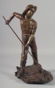J DALBREUSE A BRONZE SCULPTURE OF A MAN WITH A SHRIMPING NET standing on a rustic base. Signed 16ins