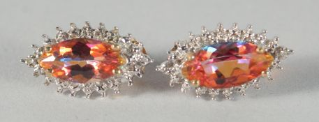A PAIR OF 9ct. GOLD TOPAZ AND DIAMOND MARQUISE EARRINGS.