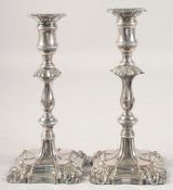 A PAIR OF 19TH CENTURY PAINTED CANDLESTICKS. 9ins high.