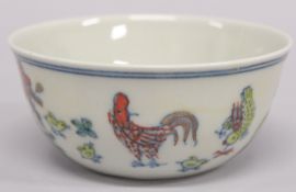 A SMALL CHINESE DOUCAI CHICKEN CUP.