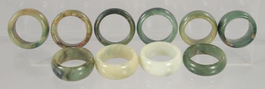 TEN VARIOUS JADE RINGS.
