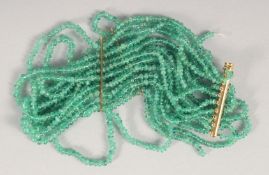 AN 18CT GOLD EMERALD BEAD BRACELET.
