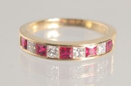 AN 18CT RUBY AND DIAMOND HALF ETERNITY RING.