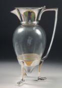 A CHRISTOPHER DRESSER STYLE CLARET JUG, on three curving legs. 10