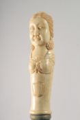 A WALKING STICK WITH CARVED BONE HANDLE modelled as a woman.
