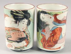 A PAIR OF JAPANESE SEMI-EROTIC BRUSH HOLDERS. 4.5ins high.