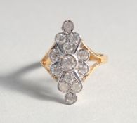 A GOLD-PLATED SILVER CUBIC ZIRCONIA CLUSTER RING.