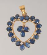 A GOLD SAPPHIRE HEART PENDANT.