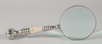 A MAGNIFYING GLASS with chrome and mother of pearl handle.