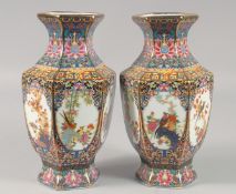 A PAIR OF CHINESE HEXAGONAL SHAPED PORCELAIN VASES decorated with panels of birds 9.5ins high.