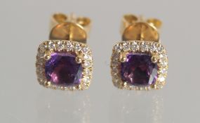 A PAIR OF 18CT AMETHYST DIAMOND CLUSTER EAR STUDS
