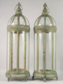 A LARGE PAIR OF ORNATE CIRCULAR LANTERNS with verdigris patination. 35ins high