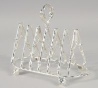 A NOVELTY PLATED TOAST RACK MODELLED AS WHIPS.