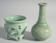 A CHINESE CELADON VASE, 7ins high and a stand, 3.5ins.
