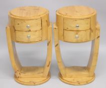 A PAIR OF ART DECO STYLE CIRCULAR TWO DRAWER BEDSIDE TABLES. 1ft 4ins diameter x 2ft 4ins high.