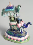 A SMALL INDIAN ENAMELLED SILVER ELEPHANT FIGURE, with riders, 9cm high.
