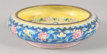 A 19TH CENTURY CHINESE CANTON ENAMEL BOWL, the interior decorated with a central panel depicting