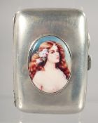 A SILVER CIGARETTE CASE, with later oval enamel of a naked female bust. 8cm x 5.5cm