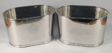 A PAIR OF OVAL METAL CHAMPAGNE COOLERS. 17