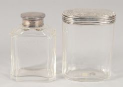 TWO SILVER TOP BOTTLES.