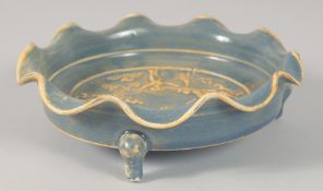 A CHINESE PETAL FORM RIM CELADON BOWL, with relief figural decoration to the interior and raised