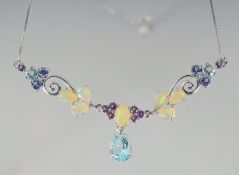 A SILVER OPAL, BLUE TOPAZ, IOLITE AND AMETHYST NECKLACE.