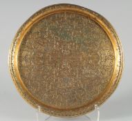 A FINE OTTOMAN TURKISH GILDED COPPER TOMBAK TRAY, with engraved calligraphy and panels of mosques,