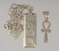 A SILVER INGOT AND CHAIN.