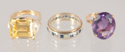 THREE VARIOUS GOLD RINGS.