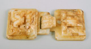 A CHINESE CARVED JADE BUCKLE, with two locking pieces (2).