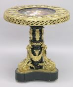 AN IMPRESSIVE ORMOLU AND EBONISED PEDESTAL TABLE inset with a central Sevres style porcelain plaque,