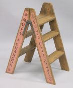 A PAIR OF NOVELTY WOODEN STEPS. 2ft 10ins high.