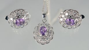 A SILVER AMETHYST CLUSTER PENDANT AND EAR CLIPS.