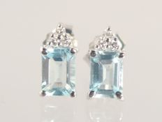 A PAIR OF 18CT WHITE GOLD AQUAMARINE AND DIAMOND EAR STUDS.