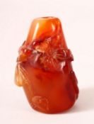 A CHINESE CARVED AGATE SNUFF BOTTLE. 5.5cm.