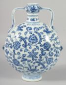 A CHINESE BLUE AND WHITE PORCELAIN TWIN HANDLE MOON FLASK, (damage to one handle), 29cm high.