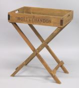 A NOVELTY WOODEN TRAY on stand. 2ft 2ins wide.