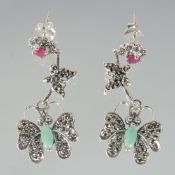 A PAIR OF SILVER RUBY EMERALD AND MARCASITE BUTTERFLY DROP EARRINGS.