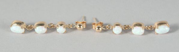 A PAIR OF 9ct. GOLD THREE OPAL DROP EARRINGS.