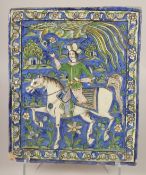 A LARGE 19TH CENTURY PERSIAN QAJAR GLAZED POTTERY TILE, depicting a horse and rider, 36.5cm x 30cm.