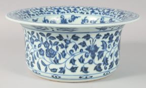 A CHINESE BLUE AND WHITE PORCELAIN WASH BASIN, decorated with flower heads and vine, the interior