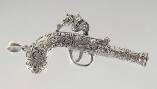 A SILVER PISTOL WHISTLE. 6cm