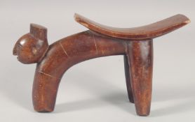 A THREE LEGGED TRIBAL HEAD REST. 8.5ins long.