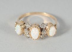 A GOOD 9ct. GOLD OPAL AND DIAMOND RING.
